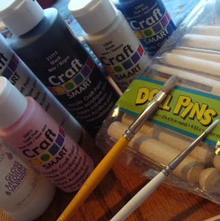 Paints paint brushes and doll pins