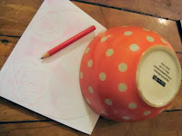 Upside-down bowl and pencil on scrapbook paper