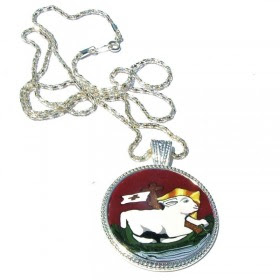 Silver medallion with image of lamb