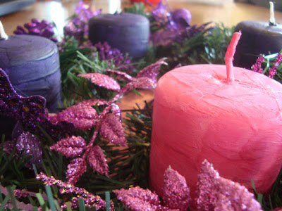Wreath with pink and purple candles