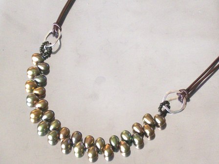 Gorgeous olive tear-drop pearl attached to double-strand leather necklace - $38 SOLD