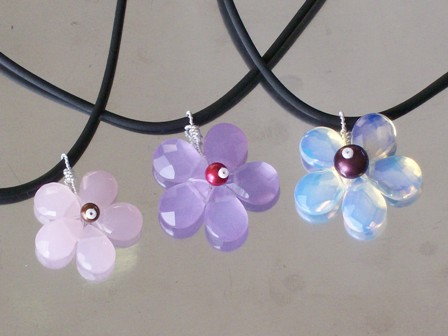Faceted glass or stone flower necklaces - $24