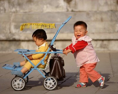 kid-pushing-other-kids-in-rikshaw