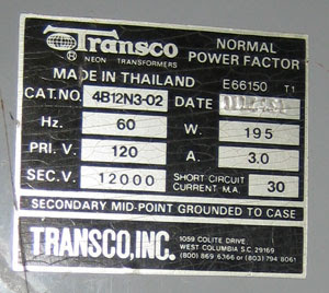 close up of neon sign transformer specs: 12000 volts at 30 mA