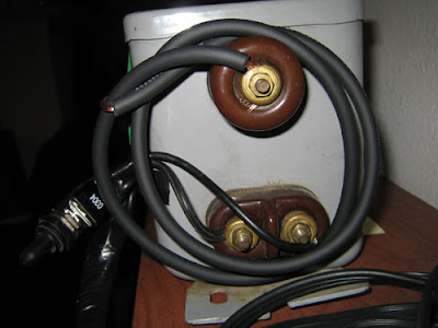 side view of neon sign transform where high voltage wire attaches
