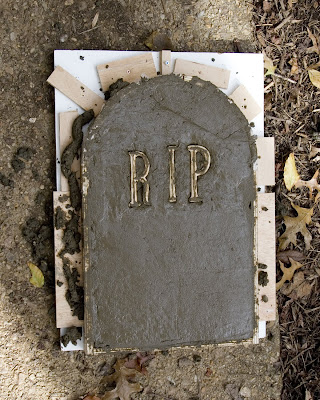 The tombstone mold filled with concrete.