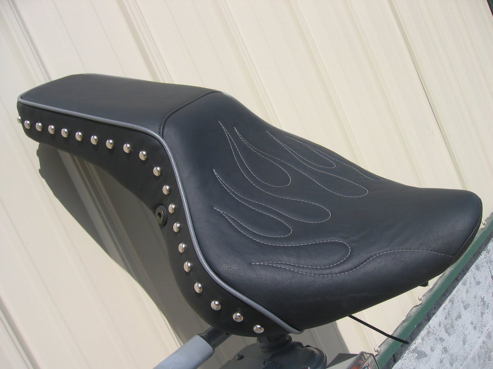 Homestyle Custom Upholstery and Awning Custom Black Cycle Seat with Flames