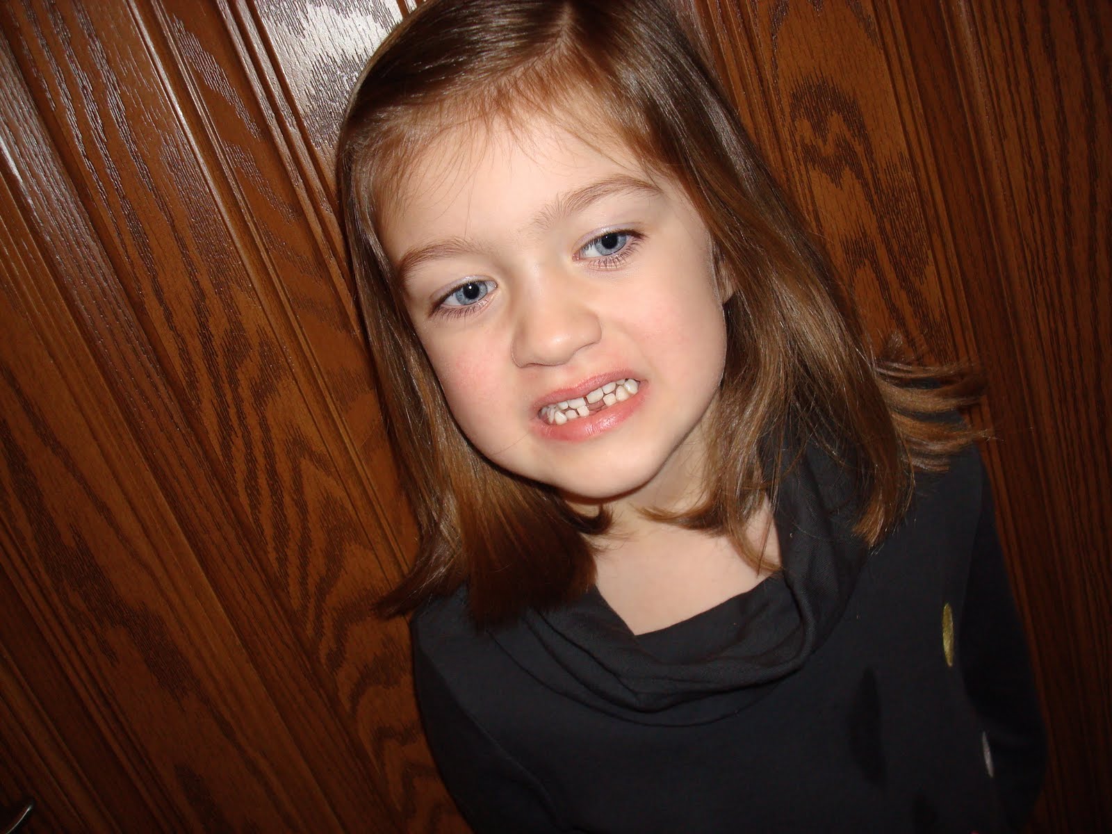 Precious girls The 1st loose tooth is out!