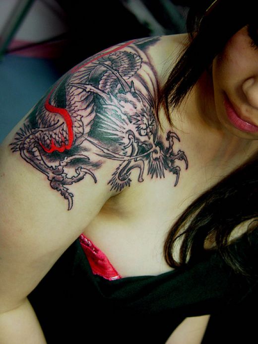 chinese dragon tattoo on arm. miranda lambert tattoo on arm.