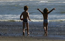 Kids running on beach
