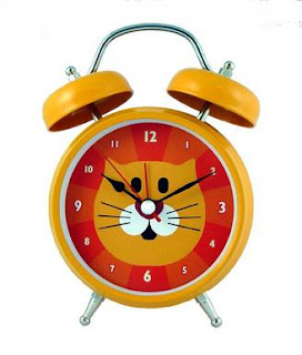 alarm clock with cat face on the clock face