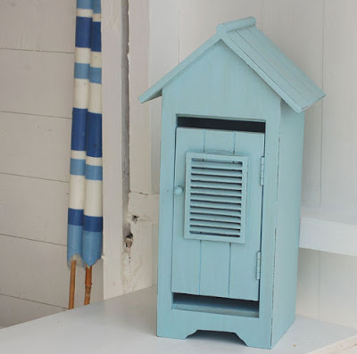 blue beach hut shaped cabinet