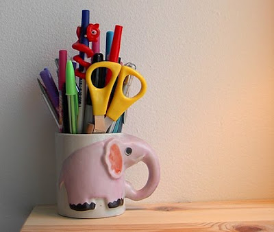 elephant coffee mug holding pens