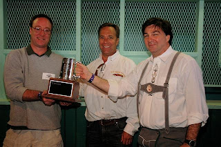 Mike McDonald of Red Brick accepts Governor's Cup from last year's (and 2005) winner, Hugh Sisson of Clipper City Brewing Company.