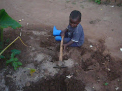 Baby Prince gardening in his boots