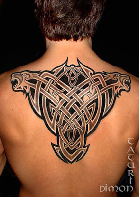 Celtic rib cage tattoo with negative tribal veil
