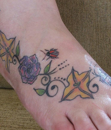 Ladybug Flowers and Leaf Tattoo on Foot