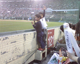 small boys watching game