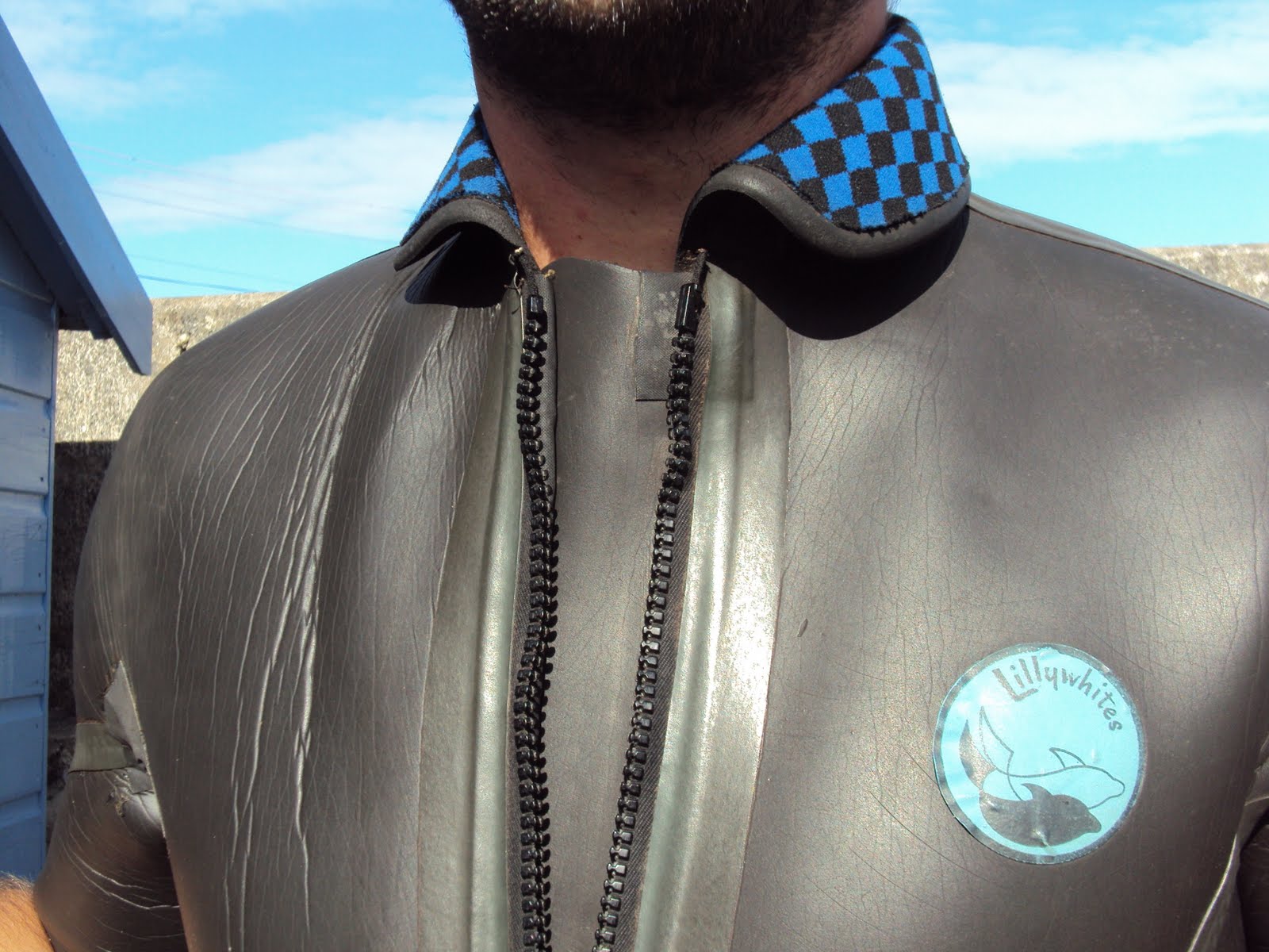 vintage surfboard collector UK wearing a 60s wetsuit