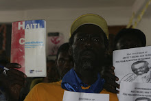 Fired worker holding Hatian Constitution