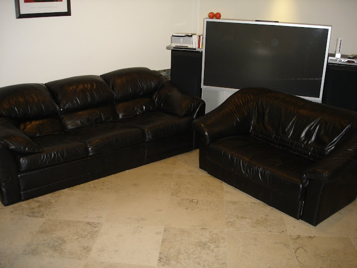2 black couches & a 57" Sony High Def TV $750