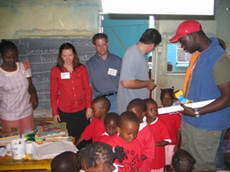 [Ken+Okoth,+Matt,+John+and+Michell+handing+over+the+gifts+from+Potomac+to+the+nusery+class+kids+.JPG]