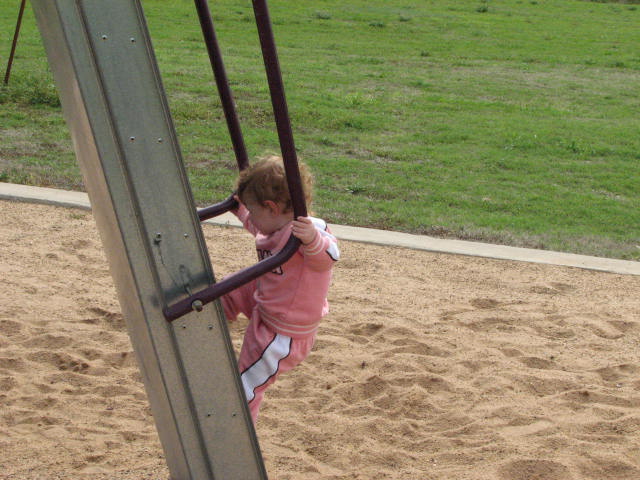 Kaydence climbing the ladder to the Slide.