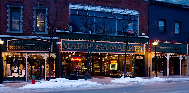 the Mariposa Market storefront in downtown Orillia; the sign in dark green with gold lettering