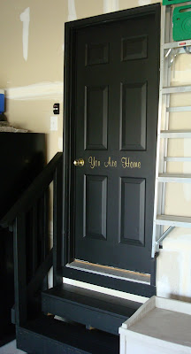 "You are home" saying on black door