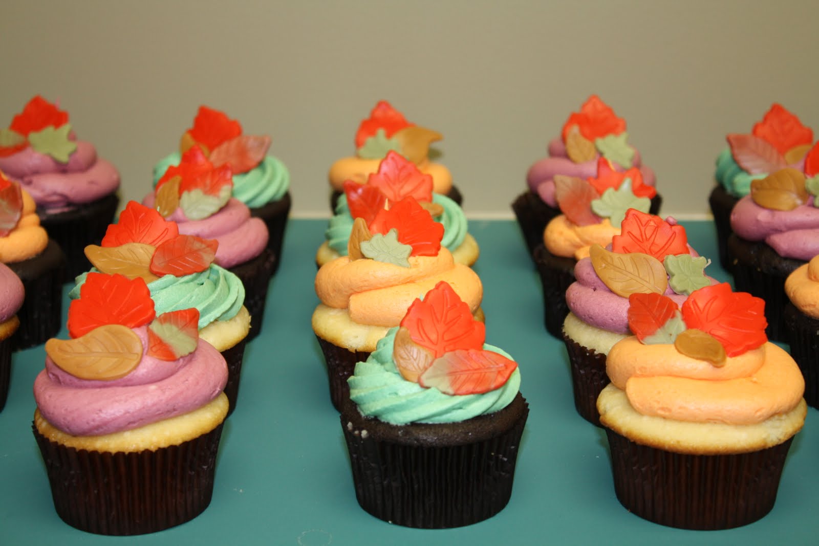 Two Sweet Bakery Fall cupcakes with fondant leaves; leaf sugar cookies