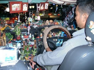 funny cars photos taxi driver filled with trinkets and rubbish