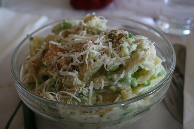 pasta, ricotta, peas and cinnamon dish topped with pecorino