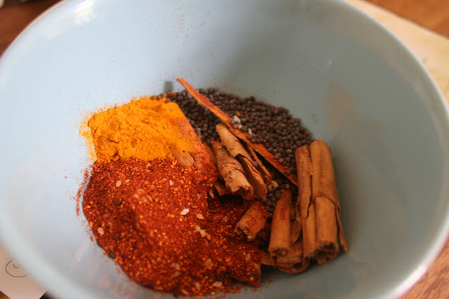 Add mustard seeds, cinnamon sticks, chilli powder, turmeric to the mix