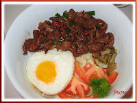 Jacq's bowl of sliced beef tenderloin with corn rice