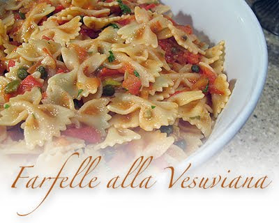 A close up photo of farfelle alla vesuvinana in a bowl.