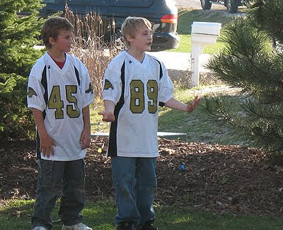 An old photo of Amanda\'s son Dominic at the end of season party, playing catch with teammates. 