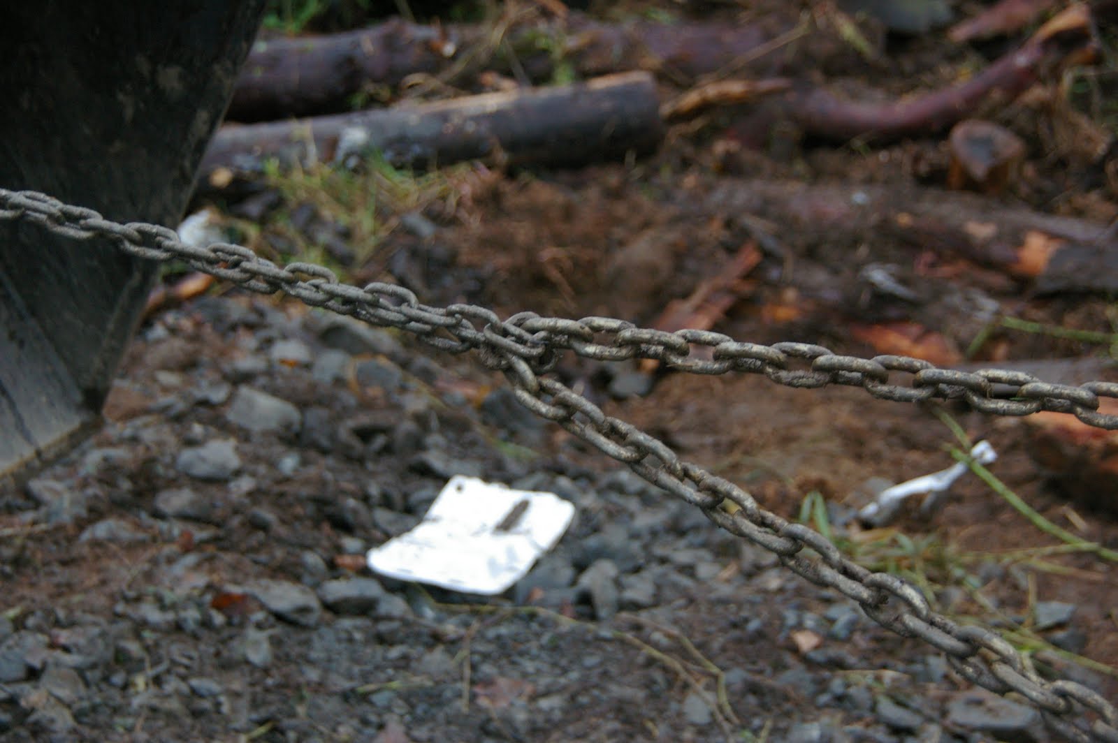 meat Stretching fencing with a tractor and a log