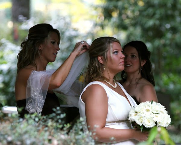 The Bride's Maids Preparing the Bride for her Wedding Day