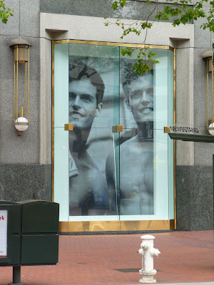 photo of an Abercrombie and Fitch window in downtown San Francisco with two hot studs