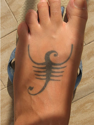 Foot Tattoo. Scorpio Sign Tattoo on the foot