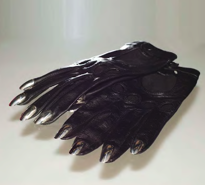 black leather driving gloves with white gold nails