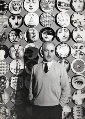 Piero Fornasetti with some plate of “Tema e Variazioni” series behind him.
