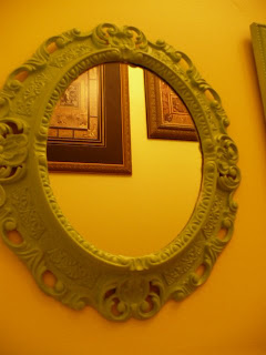 green framed mirror