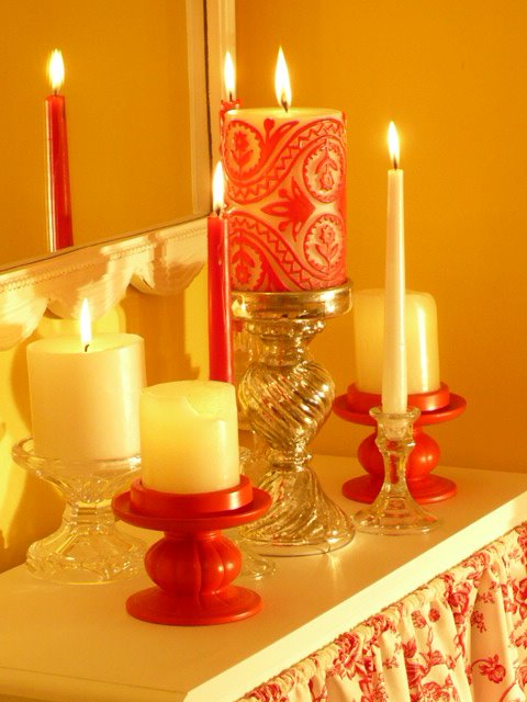 red candle holders from the thrift store