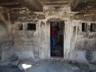 Sippy exploring the ruined buildings at the summit of medigeshi